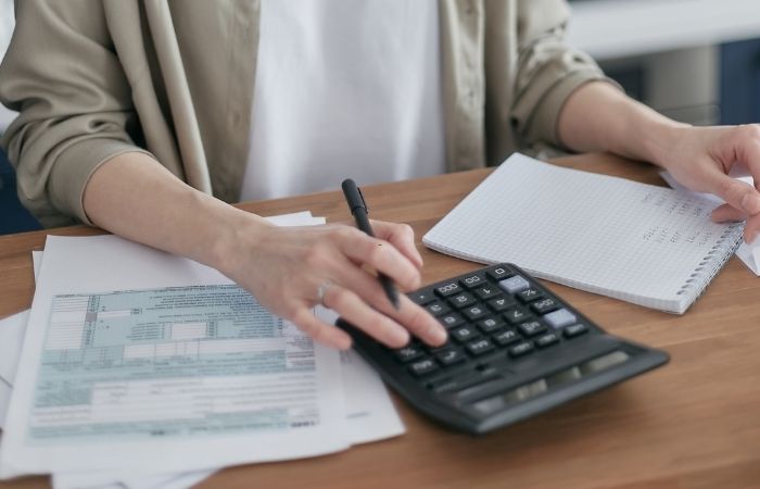 Professional payroll assistant working on laptop