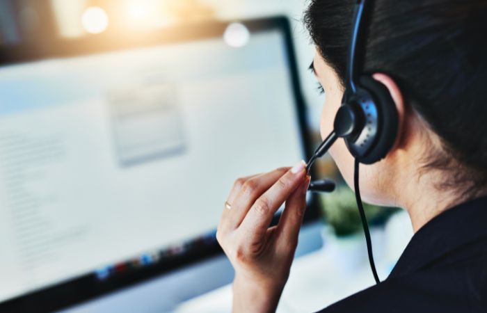 Customer service specialist talking on phone