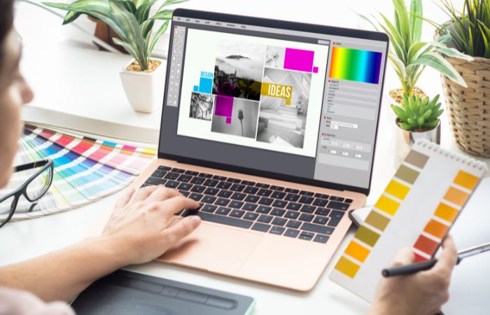 Creative workspace with tablet and color palettes