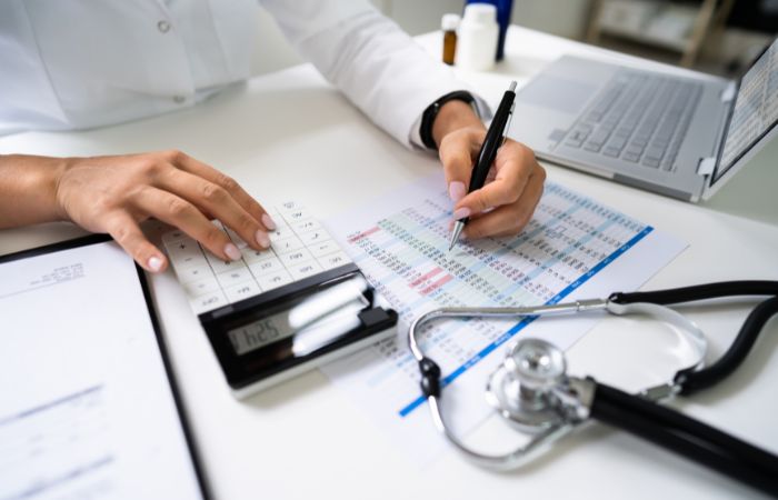 Medical billing concept with stethoscope and documents